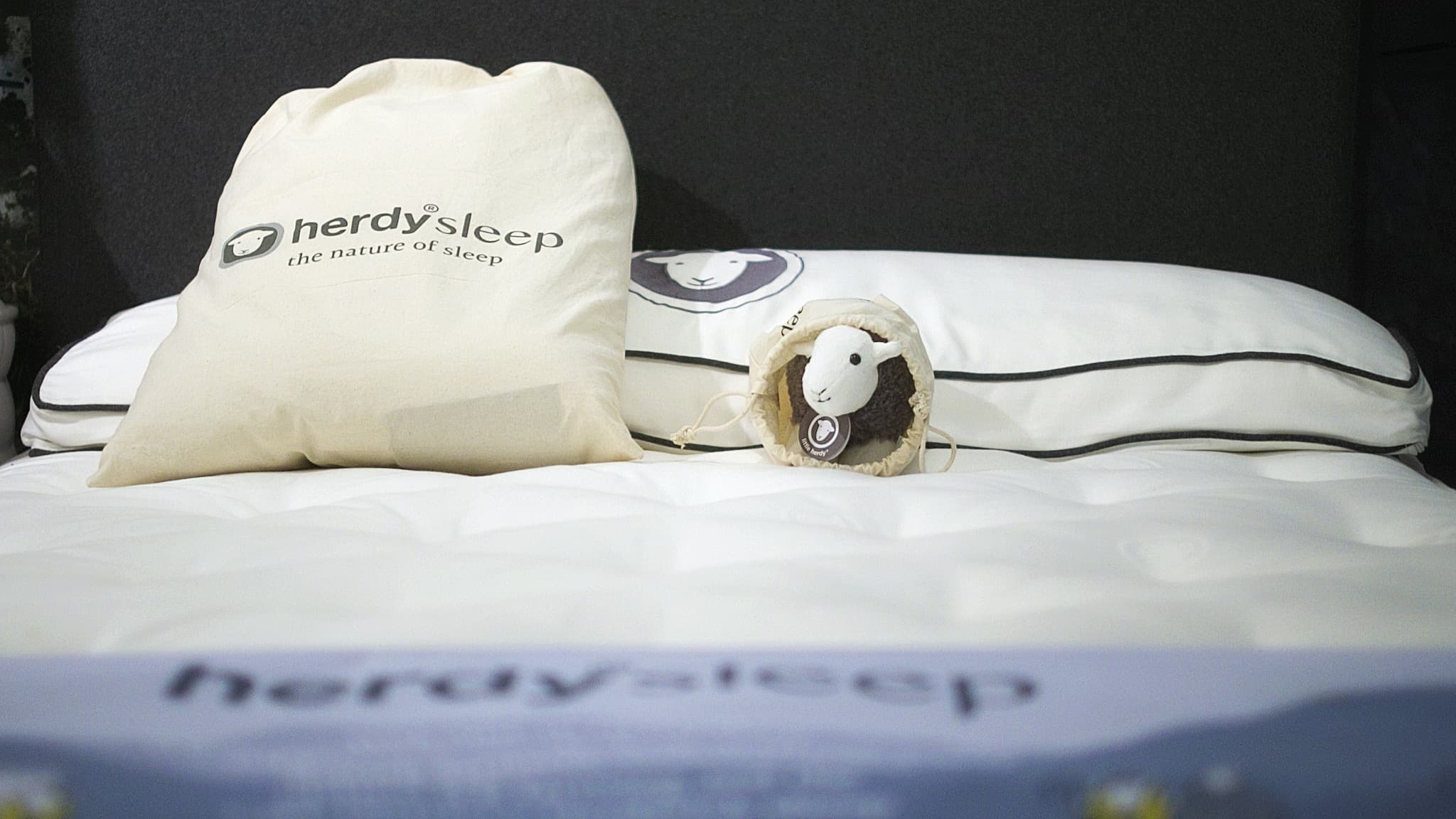 A Herysleep mattress with a Little Herdy soft toy