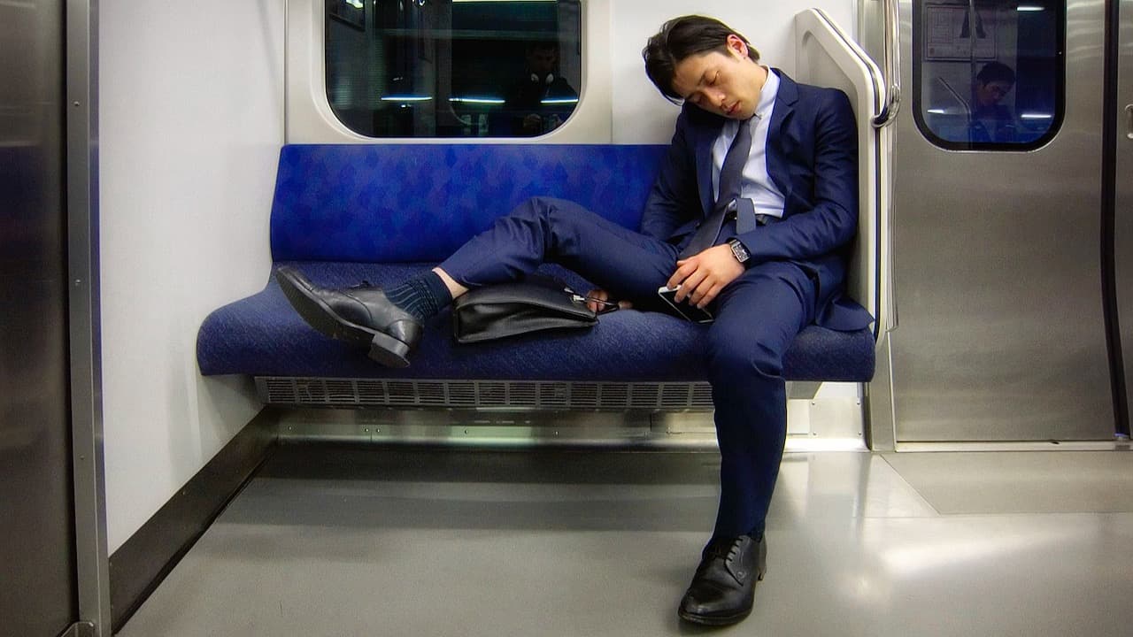 a man asleep on a Train