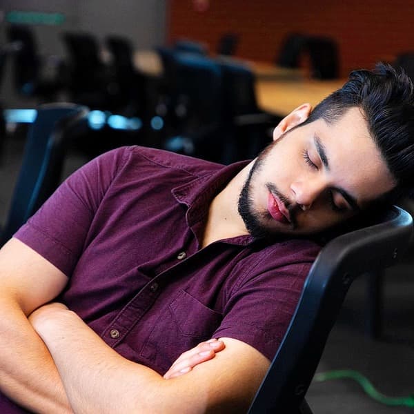 a man asleep in a chair